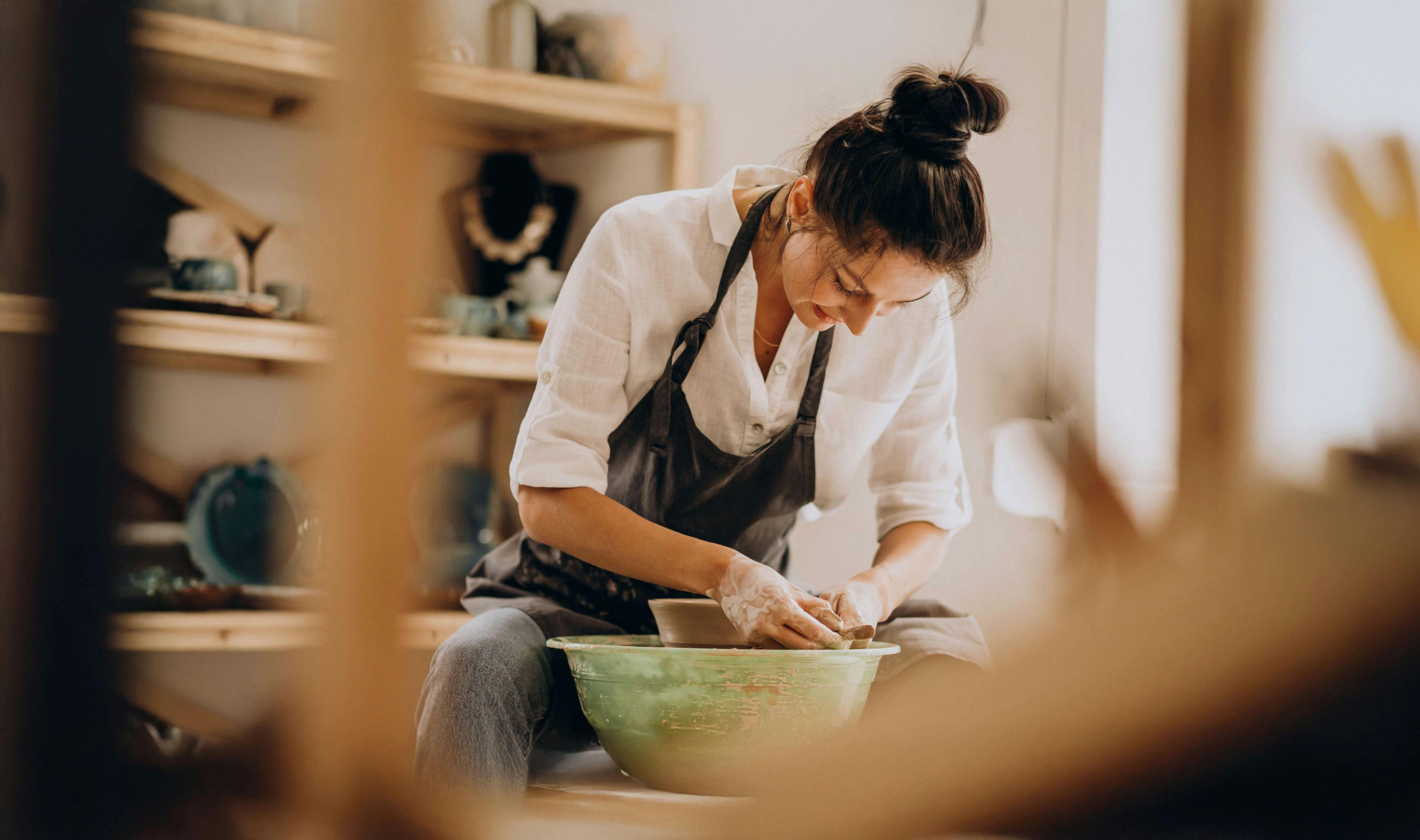Woman making pottery